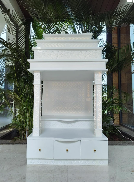 White carved temple unit with ornate columns and drawer base