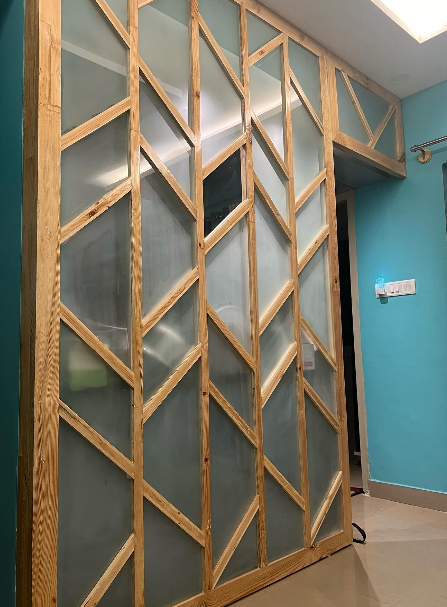 Wooden framed frosted glass partition dividing a commercial space